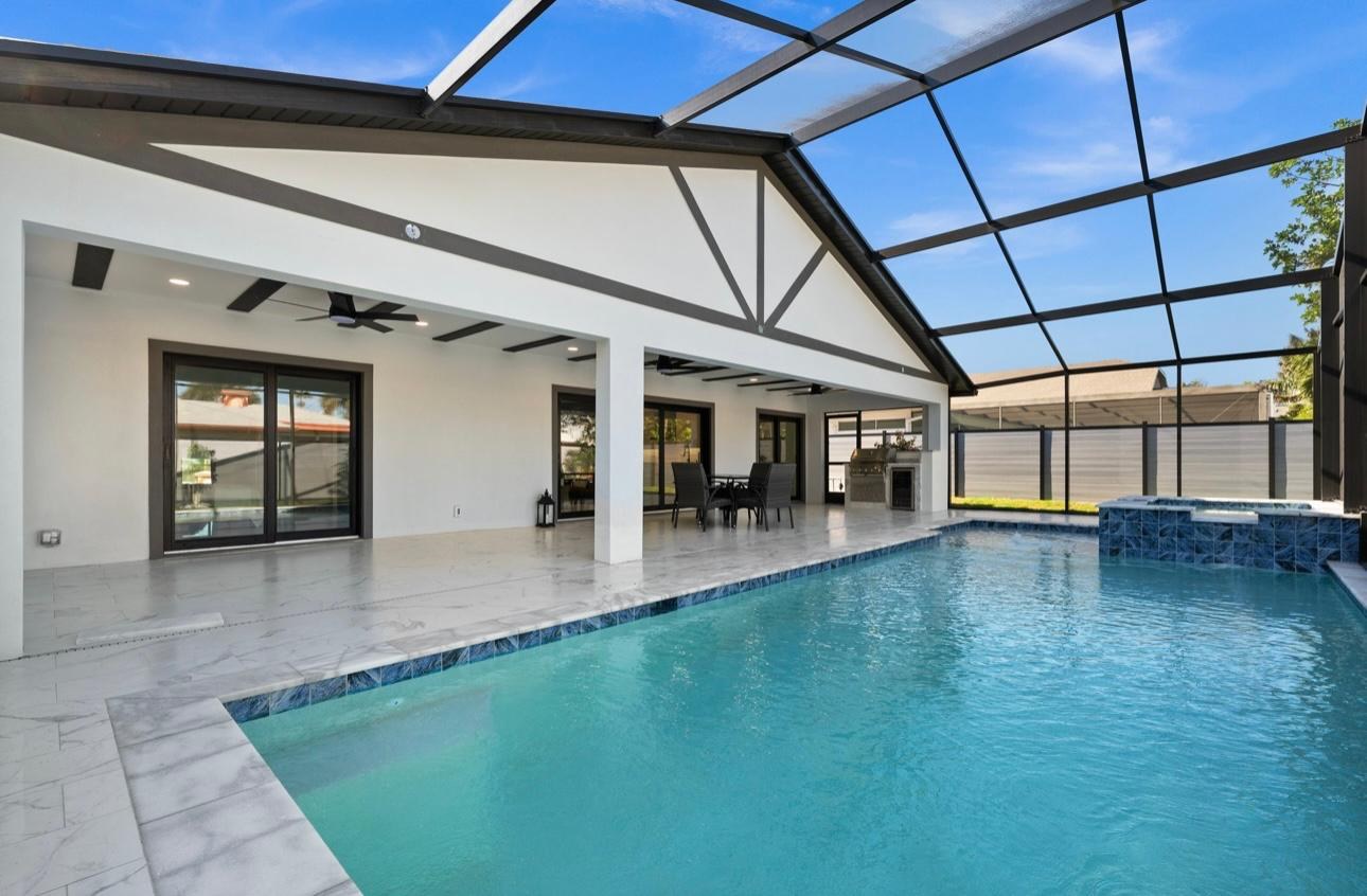 Screened pool and spa built by Excellent Choice Construction in Naples, Florida